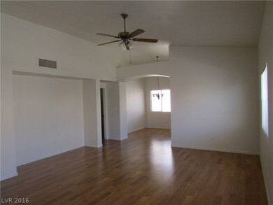 Living room with entertainment nook.  Ceiling fan