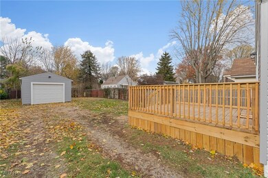 View of yard featuring a deck and an outbuilding