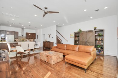 Open floor plan with high ceilings and lots of lig