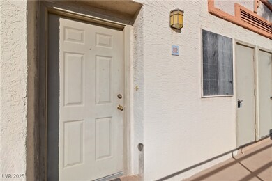 Property entrance with stucco siding