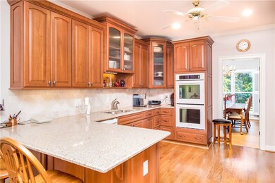 Kitchen with L-shaped serving bar & double oven