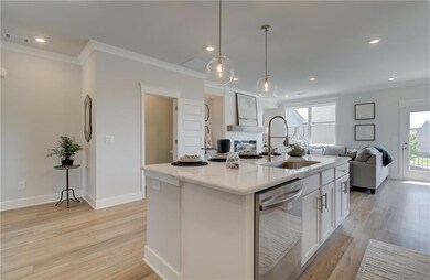 Kitchen featuring stainless steel dishwasher, sink