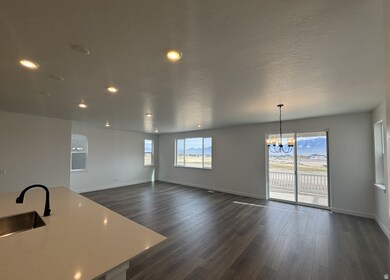 Unfurnished dining area featuring dark wood-style floors, a chandelier, recessed lighting, and a textured ceiling