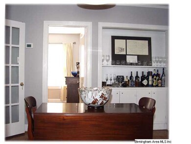 The centrally located dining room has custom built