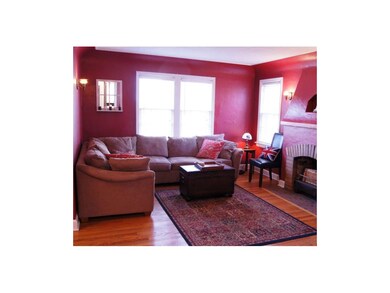Large living room with coved ceiling, fireplace wi