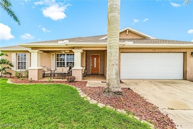 Single story home featuring covered porch, a front