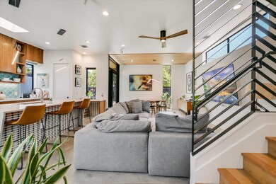 Living area featuring stairway, recessed lighting