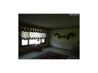 Living room w/carpet over hardwood*Neutral