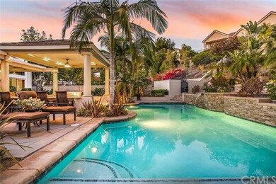 Pool with sundeck, waterfalls and raised spa that 