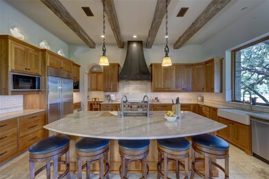 Kitchen with built in appliances, visible vents, 