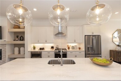 Check out this wonderful Kitchen. Features stainless steel appliances, quartz counter tops and soft close doors and drawers. Not actual home.