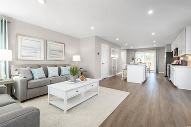 Living room with light hardwood / wood-style floor