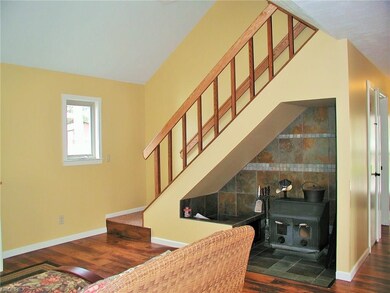 Beautiful tile surrounding the wood burner.