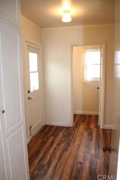 Large laundry/utility room with 1/2 bath and door 