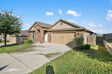 Ranch-style house with brick siding, concrete driveway, and a garage