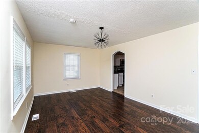 Living Room, arched door to Kitchen