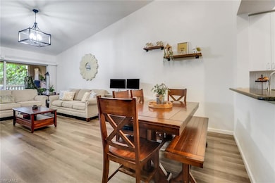 Dining room featuring a notable chandelier, basebo
