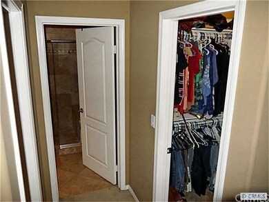 His & Her Closets in open hallway between Bedroom 