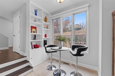 Breakfast Nook with large window & built in shelvi