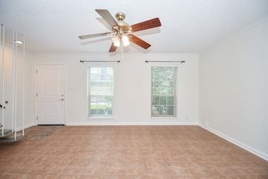 View of the spacious living room and front door. P