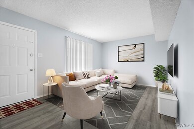 Living room featuring a textured ceiling and dark hardwood / wood-style floors