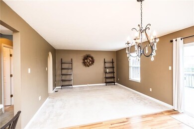 The family room features warm, neutral colors to c