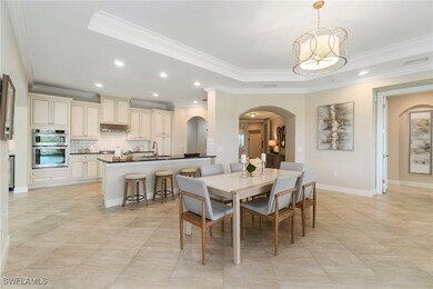 Dining space featuring arched walkways, ornamental