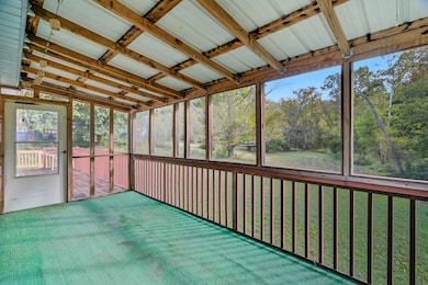 Covered and screened-in deck off Primary Bedroom