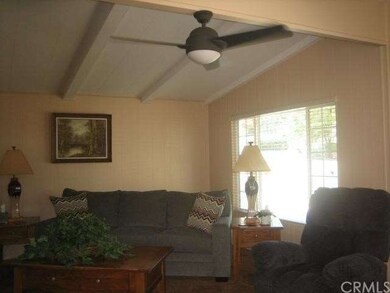 Open living room with lots of windows, vaulted cei
