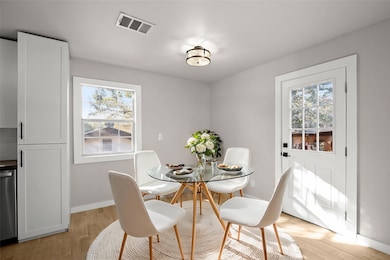 Dining space featuring light wood finished floors