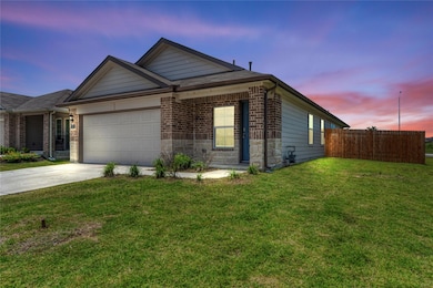 Single story home featuring driveway, an attached