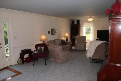 Family room with a glimpse of the door to the back