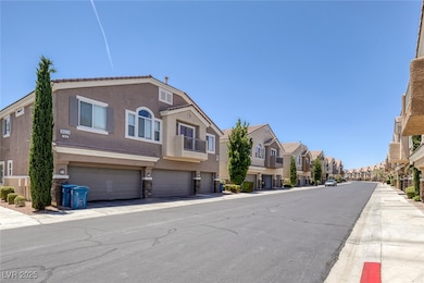 View of asphalt street featuring a residential view and sidewalks