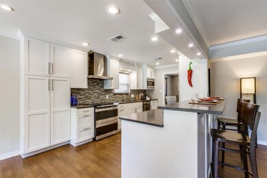 Fantastic kitchen with sleek white cabinets.