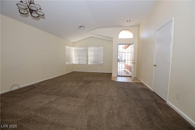 Spare room with lofted ceiling, carpet flooring, b