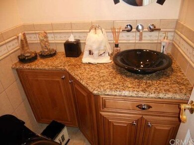 Counter top and bowl sink in 1/2 bath. 