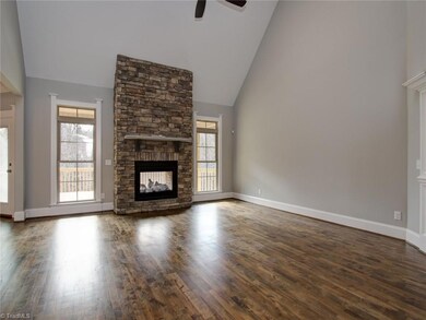 A stacked stone fireplace is the focal point of this Great Room.  It has a nice flow to keeping room and kitchen.  Beautiful maple hardwoods here also.