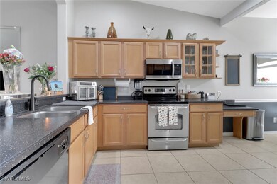 Kitchen featuring stainless steel appliances, glas