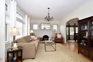 LIVING ROOM WITH COZY WOOD BURNING FIREPLACE