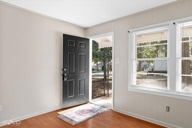 Foyer entrance with hardwood / wood-style flooring
