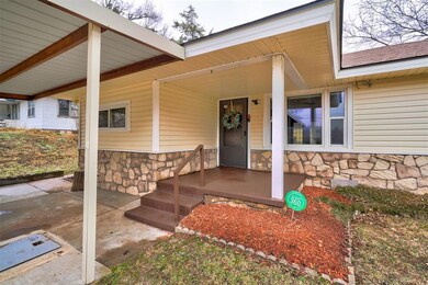 Property entrance with covered porch