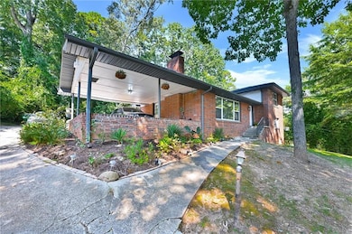 View of front of property featuring brick siding a