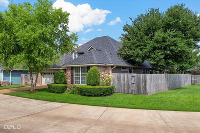 View of front of home featuring a garage and a fro
