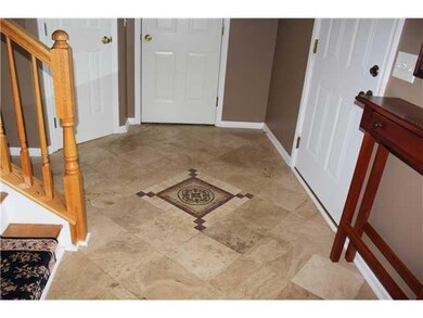 Foyer. Gorgeous travertine tiled foyer.