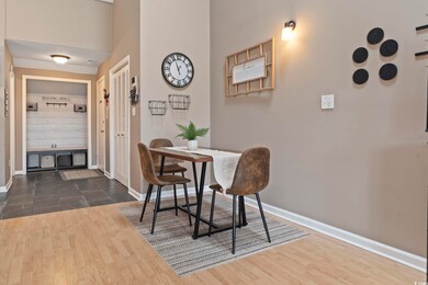 Dining area featuring dark wood-type flooring