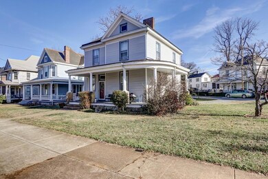 FRONT OF HOME AND NICE LEVEL YARD.