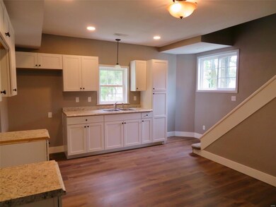 New cabinets, flooring, lighting, lots of natural 