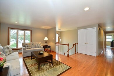 Living room with large newer windows overlooking t
