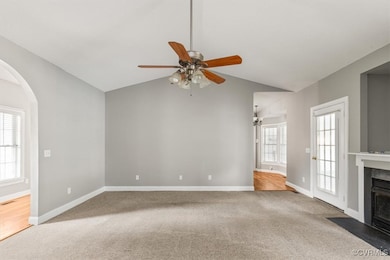 Unfurnished living room featuring carpet flooring,