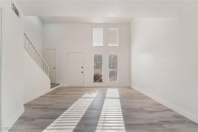 Entrance foyer with light wood finished floors, st
